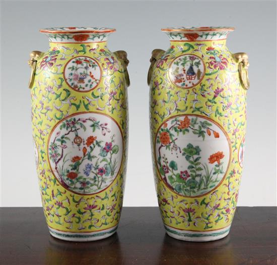 A pair of Chinese yellow ground famille rose vases, Jiaqing marks, early 20th century, 23cm